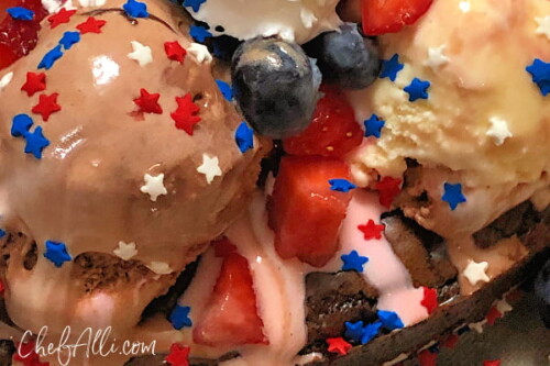 Red White and Boom Ice Cream Brownie Pie is so fun, it should be illegal! A delicious brownie base is piled high with Neapolitan ice cream, hot fudge topping, berries, bananas, whipped cream and, of course, sprinkles! Your guests are sure to be cheering (loudly!) for this easy, decadent creation.