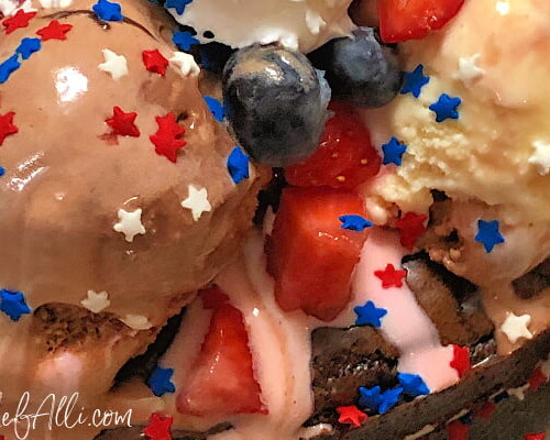 Red White and Boom Ice Cream Brownie Pie is so fun, it should be illegal! A delicious brownie base is piled high with Neapolitan ice cream, hot fudge topping, berries, bananas, whipped cream and, of course, sprinkles! Your guests are sure to be cheering (loudly!) for this easy, decadent creation.
