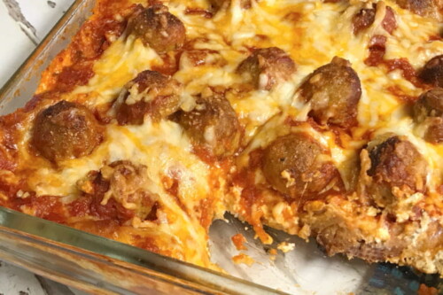 A loaded pan of meatball sub casserole.