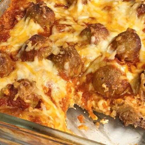 A loaded pan of meatball sub casserole.