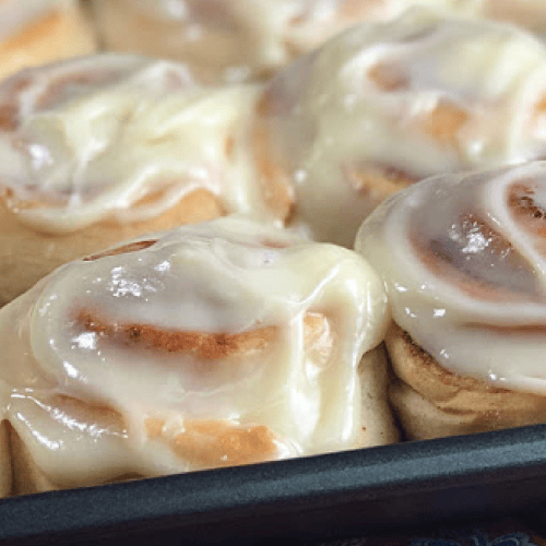 Homemade cinnamon rolls with homemade icing.