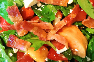 Bacon and Goat Cheese with Tomatoes and Peaches in a salad.