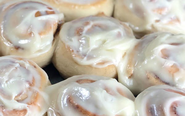 I can make a batch of these Speedy Cinnamon Rolls from start to finish in about 1 hour and 10 minutes, including the time it takes for the rolls to raise.  This recipe will make 12 very large cinnamon rolls (1 sheet pan), 16 small cinnamon rolls, or 2 large braided rings. 