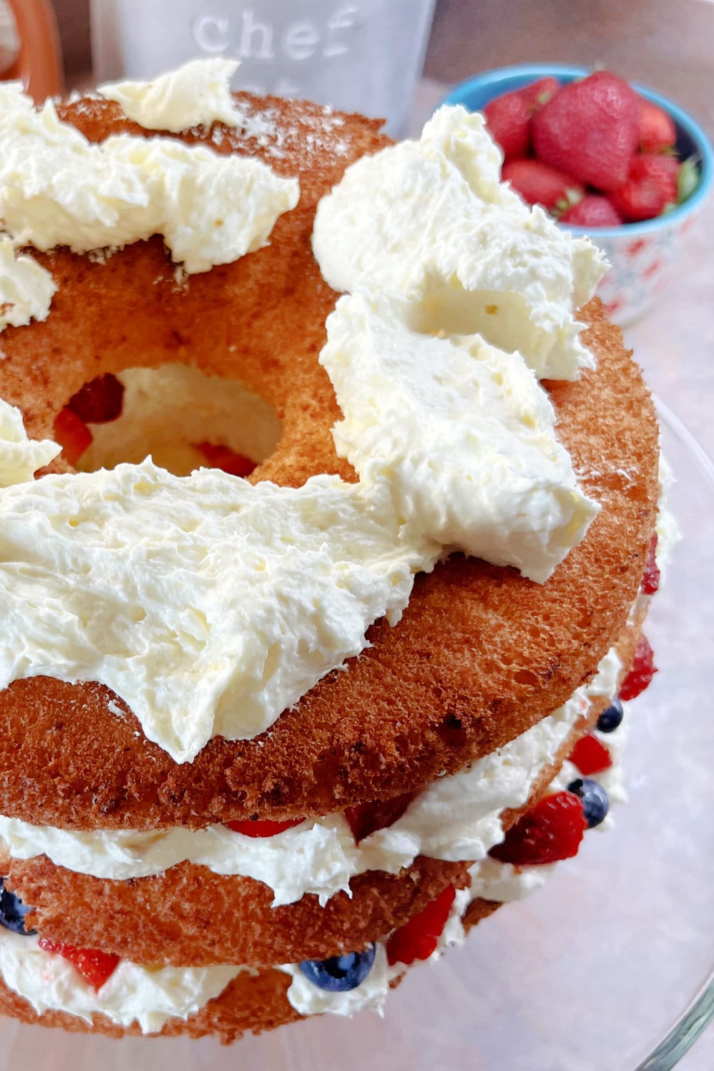 Dollops of the lemon cloud filling on the second layer of angel food cake.