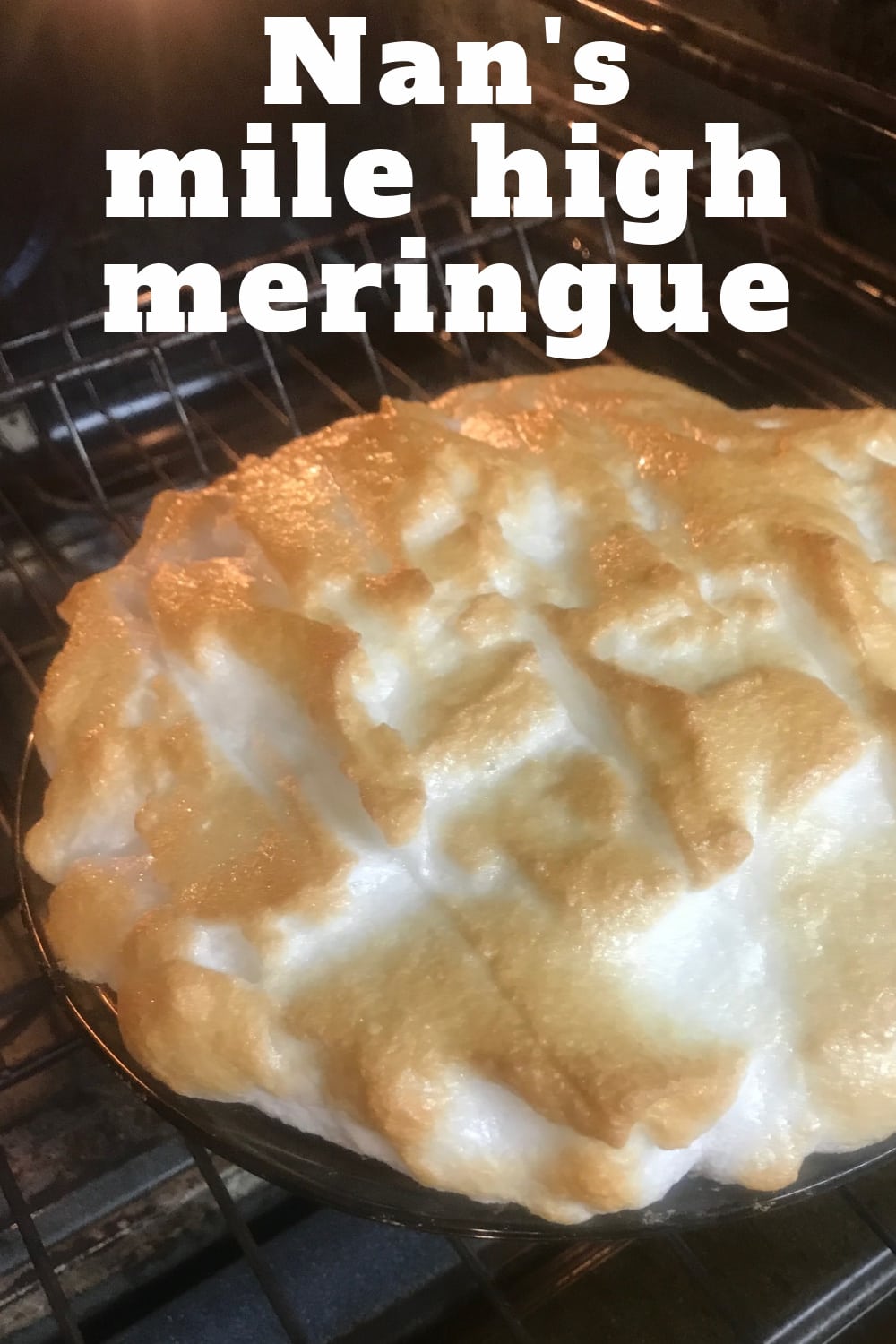 A beautiful lemon meringue pie being removed from the oven.