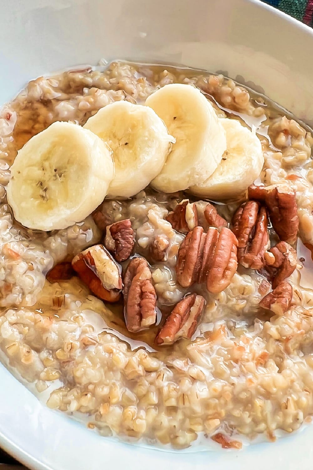 Hearty steel cut oats with pecans and sliced bananas.