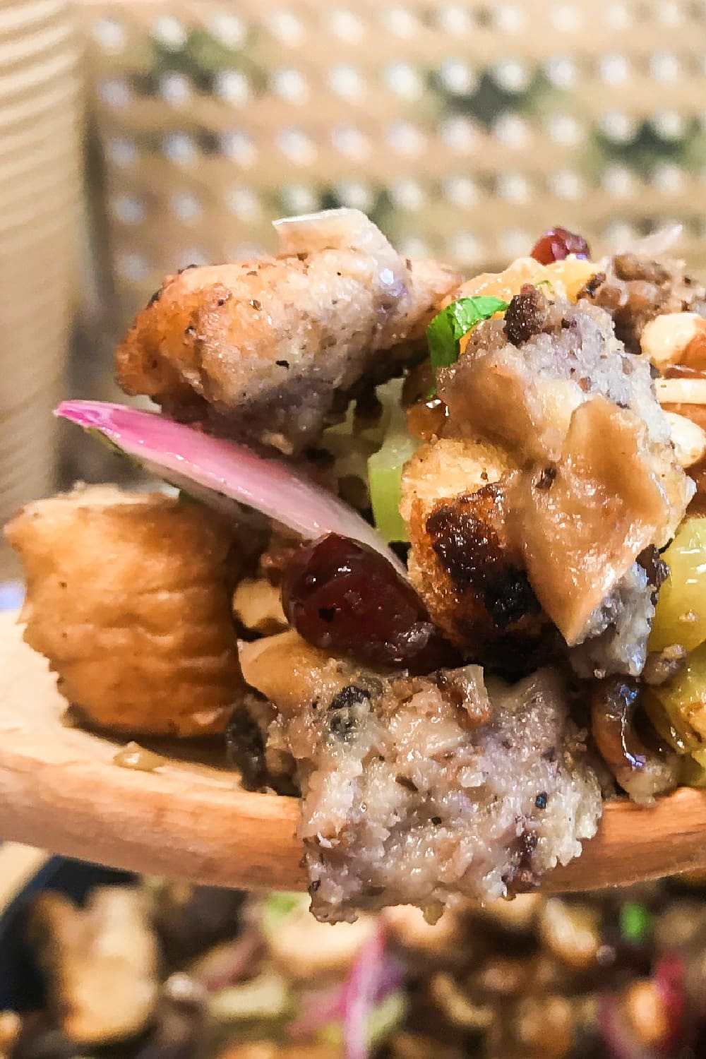 A heaping spoonful of cranberry walnut sausage dressing.