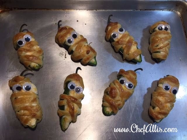 These Mummy Poppers are easy Halloween snacks that are so fun to create when Halloween parties roll around.  Mummy Poppers are fun and cute Halloween food!