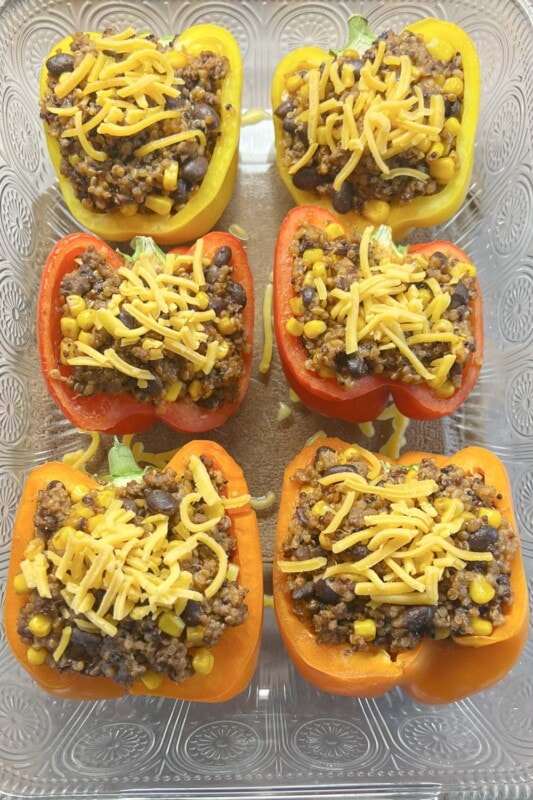 Stuffed enchilada peppers topped with shredded cheese.