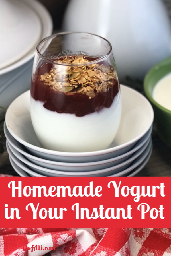yogurt parfait sitting on a stack of bowls