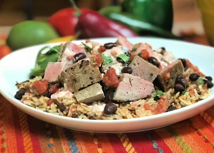 A plate of cuban pork tenderloin with black and beans and rice - so delicious!
