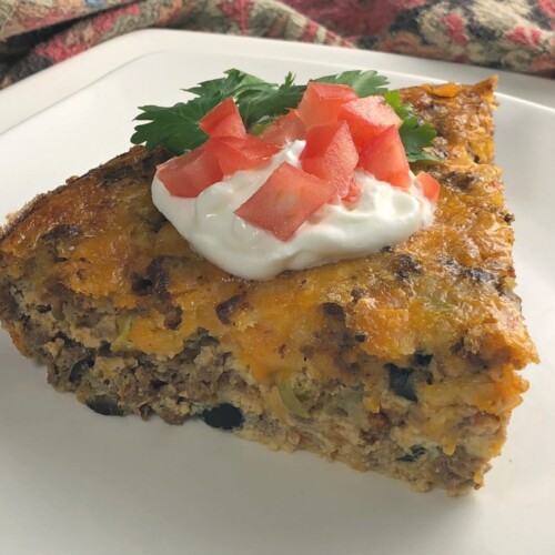 Are you looking for a delicious low-car crustless taco recipe idea?  This low-carb crustless Tex Mexican Taco pie is a family favorite!  I love how it slices up so nicely and makes a beautiful meal that tastes great!