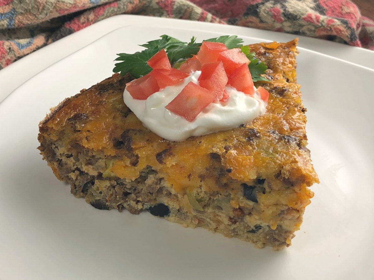 Are you looking for a delicious low-car crustless taco recipe idea?  This low-carb crustless Tex Mexican Taco pie is a family favorite!  I love how it slices up so nicely and makes a beautiful meal that tastes great!