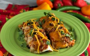 These Chicken and Bacon Black Bean Enchiladas make a fun weeknight meal and I love to double this recipe to make TWO pans - one for dinner now and one for dinner later....then I pull that sucker right out of the freezer. And, this casserole makes a pretty neat gift when somebody's grieving a loss or celebrating a birth - who doesn't love a pan of enchiladas delivered to their door when in need??   #chicken #bacon #enchiladas #casserole