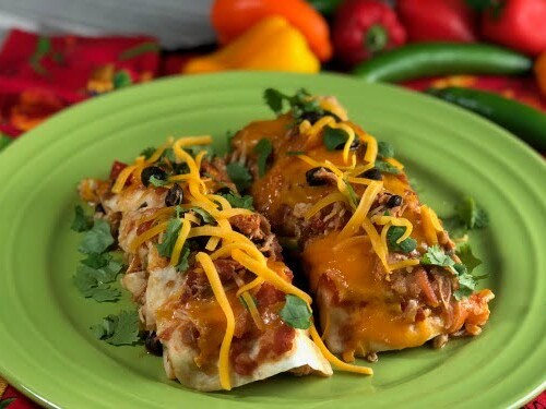 These Chicken and Bacon Black Bean Enchiladas make a fun weeknight meal and I love to double this recipe to make TWO pans - one for dinner now and one for dinner later....then I pull that sucker right out of the freezer. And, this casserole makes a pretty neat gift when somebody's grieving a loss or celebrating a birth - who doesn't love a pan of enchiladas delivered to their door when in need??   #chicken #bacon #enchiladas #casserole