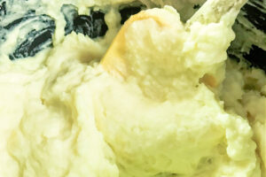 Creamy Instant Pot mashed potatoes being stirred with a spatula.