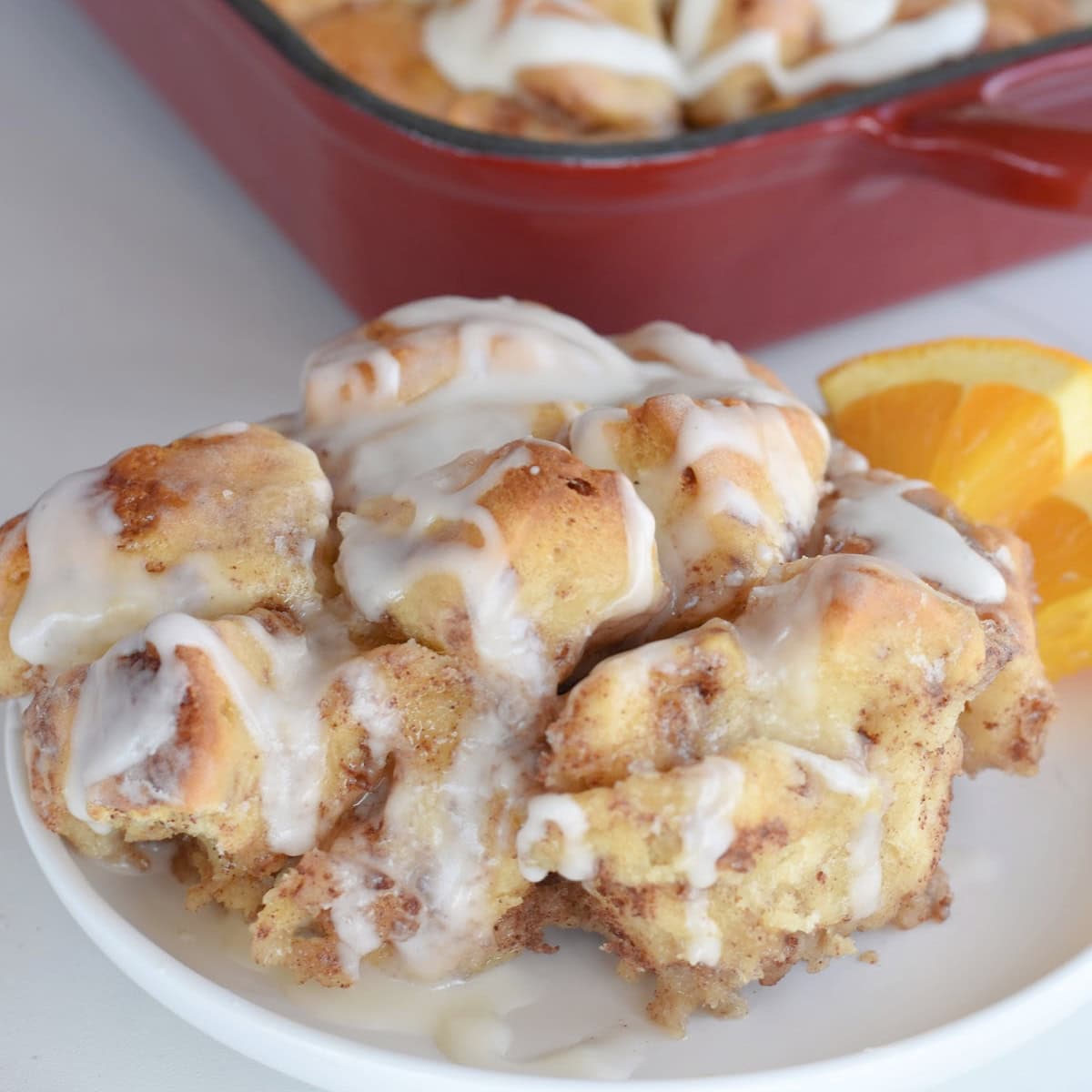 Cinnamon roll french toast casserole on a white plate.