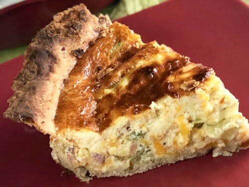 Who loves breakfast quiche for any meal of the day??  If you raised your hand, then you definitely need this quiche recipe.  My family scarfed it right down! This Easy Deep Dish Ham and Broccoli Quiche is incredibly delicious and such an easy recipe to whip up.  You only need a few basic ingredients on hand....eggs, cream, broccoli, and ham and you've got a meal all ready to hit the dinner table. #Breakfast #Brunch #Ham #Bacon #EasyMeal #Eggs #Cheddar