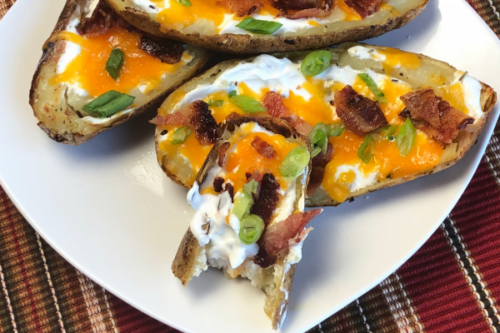 If you're looking for the perfect party appetizer, guess what??  You've just located it! Everybody seems to love these little boats of heavenly goodness - crispy skins, cheddar cheese, bacon, scallions and sour cream. 