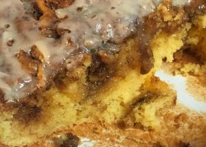 Honey bun cake in a cake pan.