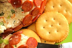 Do you love the flavors of pepperoni pizza? Our Pepperoni Pizza Cheese Ball is just a few ingredients, makes a delicious any-time appetizer, and is super easy to make. Just add your favorite crackers and serve!