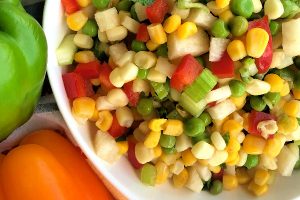 Here's a fat-free salad that's crunchy, fresh, and chock-full of vegetables. I also love how colorful this Sweet Corn and Baby Pea Salad with Jicama is. And talk about delicious on a hot summer day! #summer #salad #fresh #vegetables #crunchy #jicama #sweetcorn #babypeas