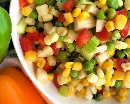 Here's a fat-free salad that's crunchy, fresh, and chock-full of vegetables. I also love how colorful this Sweet Corn and Baby Pea Salad with Jicama is. And talk about delicious on a hot summer day! #summer #salad #fresh #vegetables #crunchy #jicama #sweetcorn #babypeas