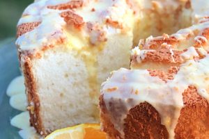 Have you ever made an angel food cake from a box mix? I was absolutely delighted at how delicious it is, not to mention easy. And, all you have to add is WATER! This Easy Angel Food Cake with Citrus Glaze is a dream to make and your guests will rave over it! #angelfood #cake #dessert #summer #bakedgoods