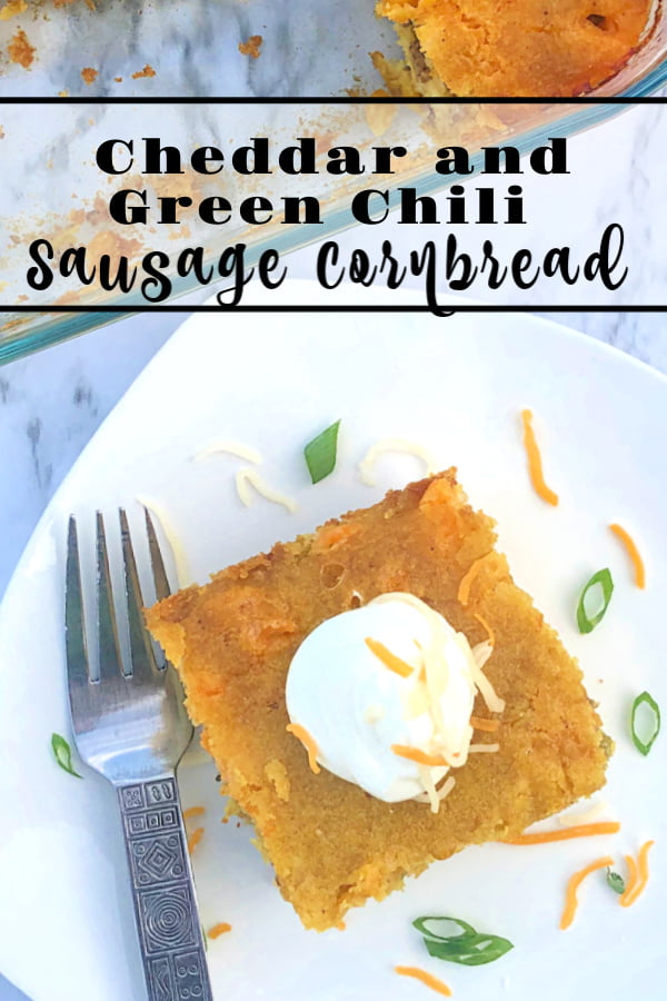 Now's the perfect time to bake up a fresh batch of Cheddar and Green Chili Sausage Cornbread! How do I know? Because it's loaded with layers of moist, dense cornbread, melted cheddar, mild green chilies, and cooked crumbled sausage. Serve topped with sour cream and sliced scallions, this is the perfect side dish for most any soup or chowder. #cornbread #cheddar #greenchilies #sausage #sidedish #soup #chowder #loaded #moist