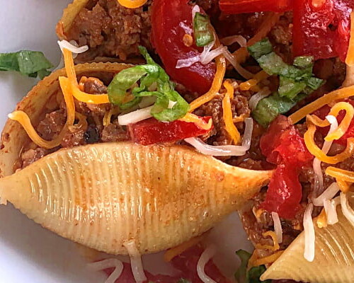 Here's a rock-solid ground beef recipe for your clan! My guys love this Cheeseburger-Stuffed Jumbo Pasta Shells casserole and I serve it up year round for them.  All the ingredients are likely already on hand in your pantry and you can throw this ground beef dish together in nothing flat. I love to make this recipe in my favorite cast iron skillet.  #speedymeal #groundbeef #casserole #skilletmeal