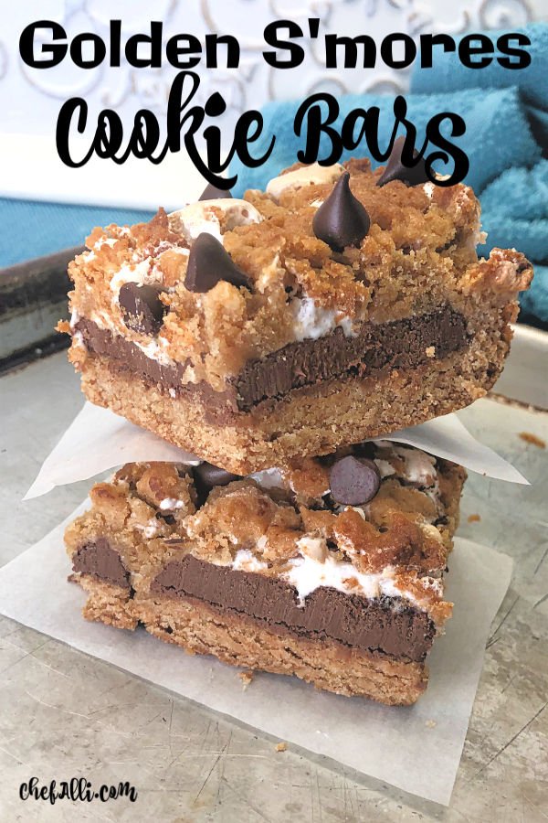 Calling all s'mores lovers!! These thick and yummy cookie bars are loaded with graham cracker flavor and oozing with warm chocolate and gooey marshmallows. We can never get enough of these Golden S'mores Cookie Bars and they are incredibly easy to make in your favorite 9 x 13 baking dish.  No campfire required. :) #grahamcrackers #marshmallows #chocolate #campfire #cookies