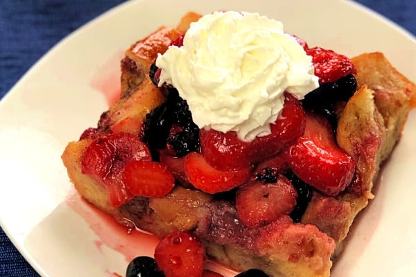 Do you have a special weekend brunch coming up? Here's what you need at the top of the menu: Very Berry French Toast Bake. Just assemble this breakfast casserole the night prior, and when morning arrives, you can bake up the most delicious pan of French Toast Bake you've ever put in your mouth! Piled high with loads of fresh berries and drizzled with warm maple syrup, your guests will delight in this pan of goodness. #FrenchToast #BreakfastCasserole #Berries