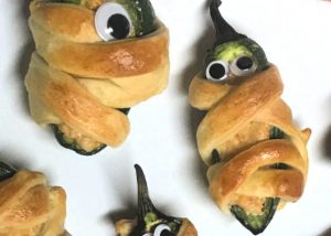 Mummy Poppers made with crescent roll dough and jalapenos.