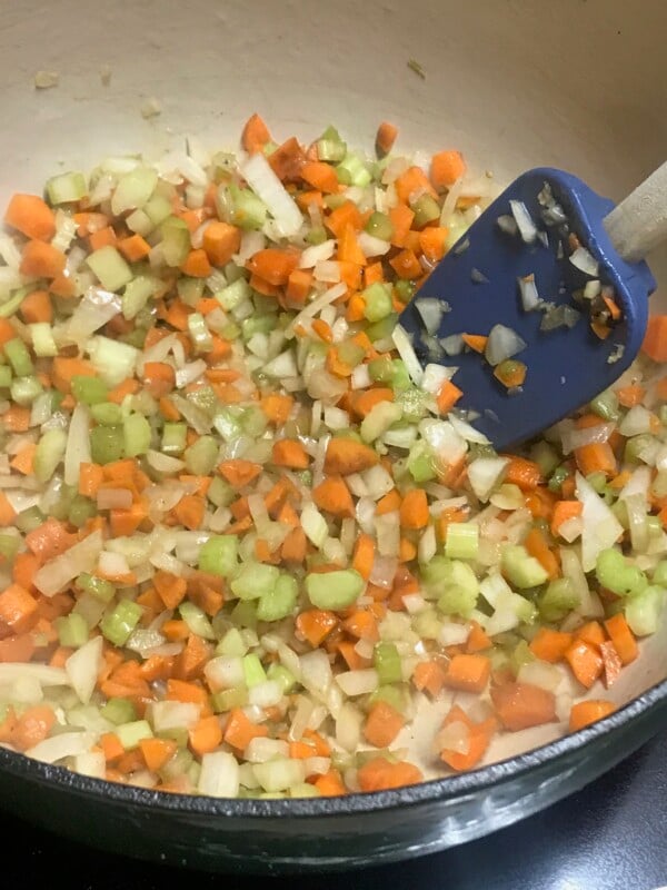 dutch-oven-vegetables Onion, celery, carrots in a dutch oven.