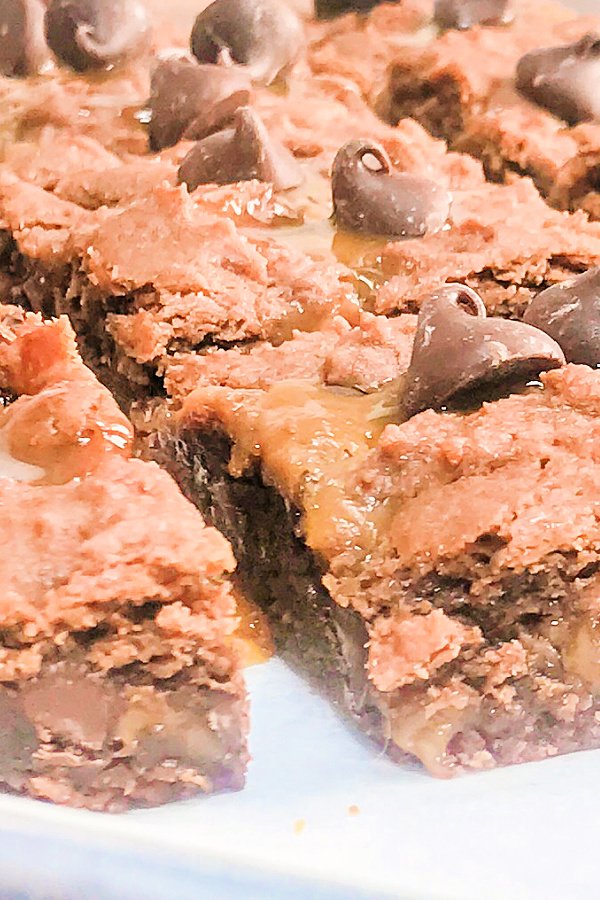 Brownies with caramel on a white plate.