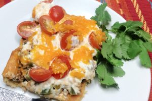 Cowgirl Casserole with a creamy ground beef filling topped with shredded cheese.