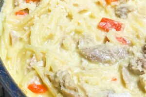 Angel hair pasta in a creamy pesto sauce with shredded chicken.