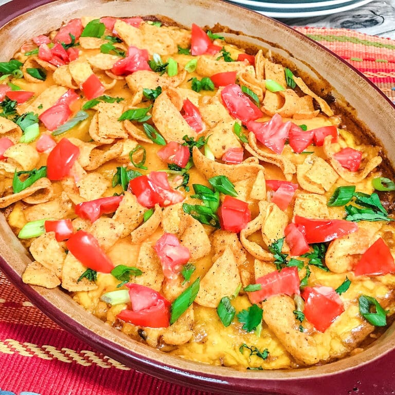Chili cheese dip in a casserole serving dish.