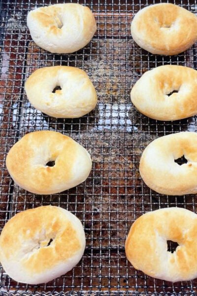 Golden brown air fryer doughnuts ready to be turned. 