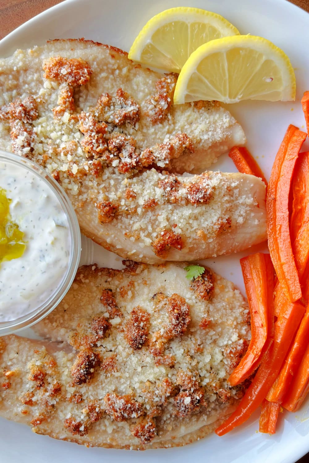 Air fried tilapia fillets with carrots and tartar sauce. 