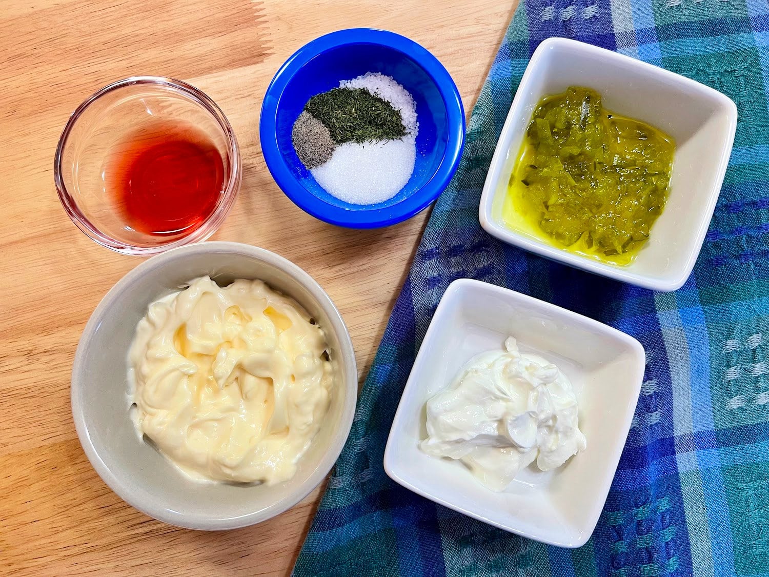 All the ingredients needed to make tartar sauce. 