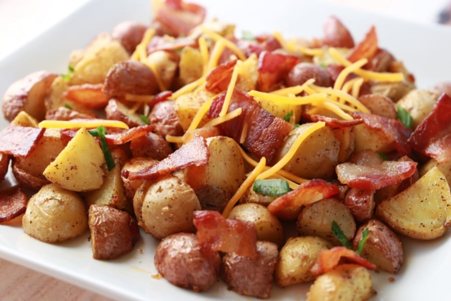 Roasted potatoes piled high with bacon on top. 