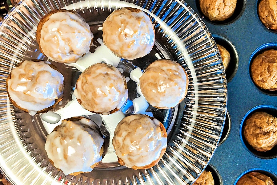 A tray of mini pumpkin muffin bites with glaze over the top. 
