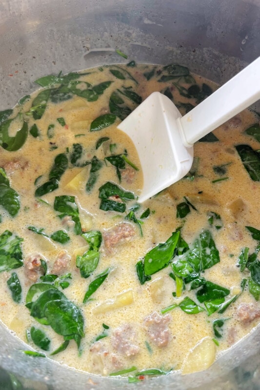 Fresh spinach stirred into the potato soup.