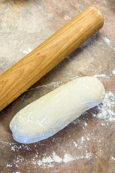 A loaf of frozen bread dough ready to roll out. 