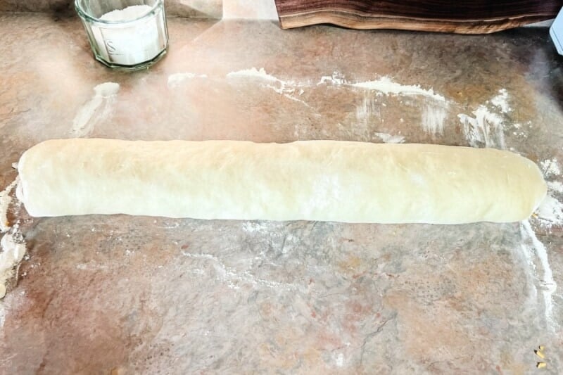 A log of dough with the ham and cheese filling inside. 