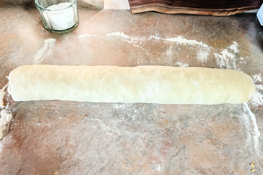 A log of dough with the ham and cheese filling inside.