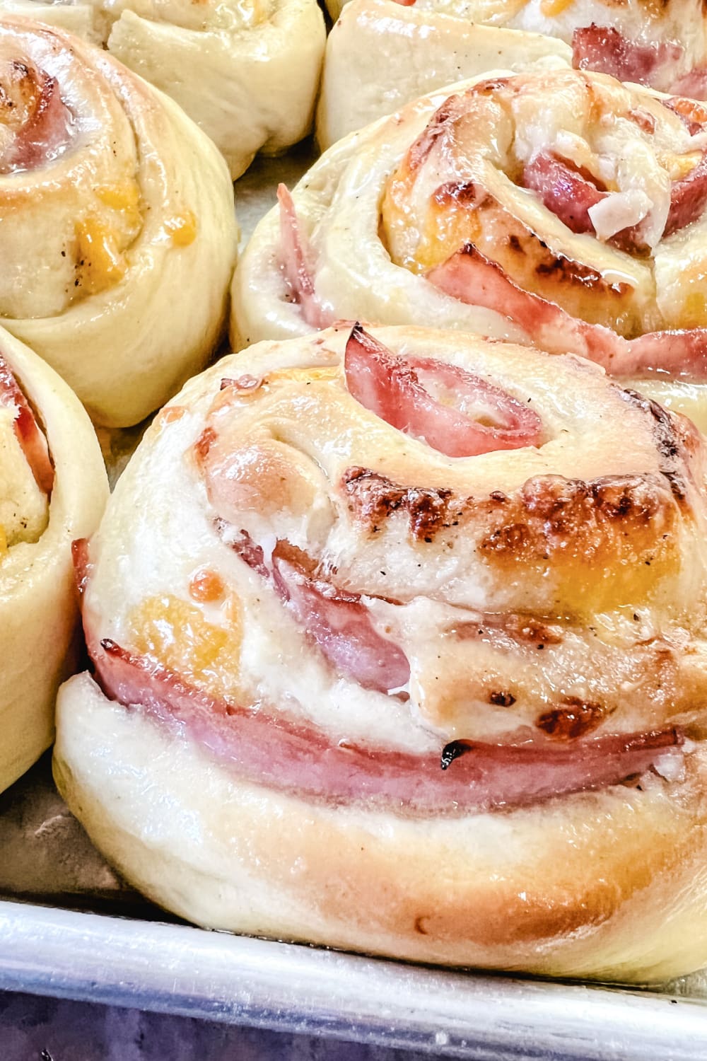 Golden brown ham and cheese rolls fresh from the oven.