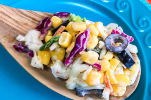 A big serving spoon full of Crunchy Mexican Slaw.