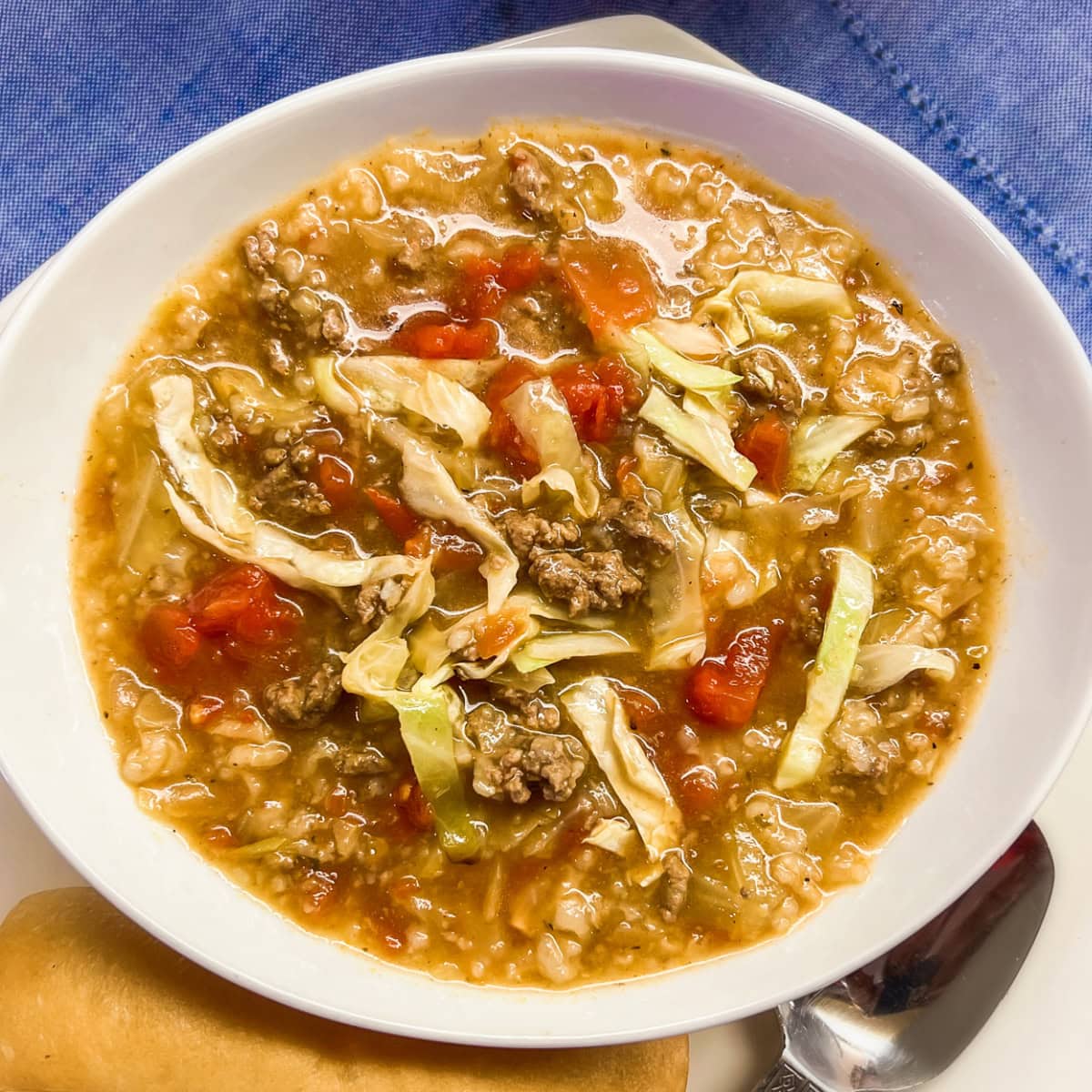 A bowl of cabbage soup made with ground beef.